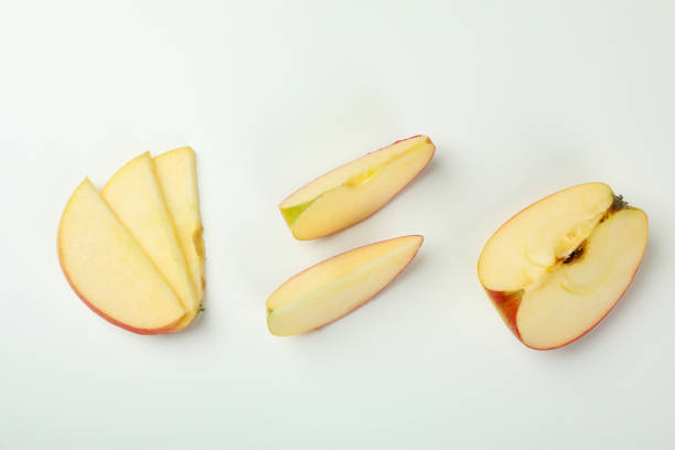 istock Ripe apple slices on white background, top view 1436083394
