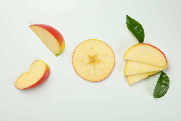 istock Ripe apple slices on white background, top view 1436083531