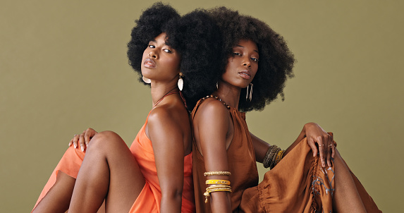 Black women, afro hair and fashion clothes on studio background in pride, empowerment and feminine energy. Portrait, confident or beauty model friends with style, trend or cool hairstyle and clothing