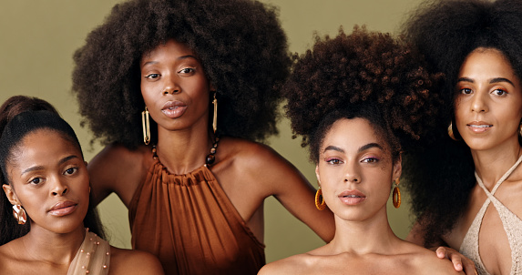 Natural beauty, model and black women with an afro hairstyle with a fashion pose. Portrait of female empowerment of people with diversity and beautiful skin looking stunning with a green background