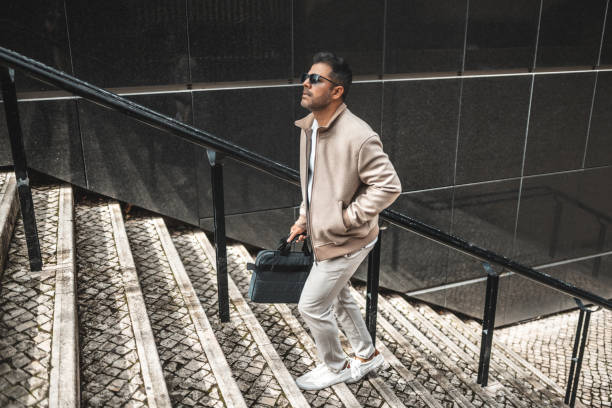 Business man walking up the stairs
