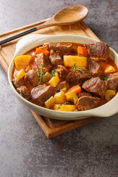 istock Irish stew stobhach is a stew native to Ireland that is traditionally made with root vegetables and meat closeup in the pot. Vertical 1436085942