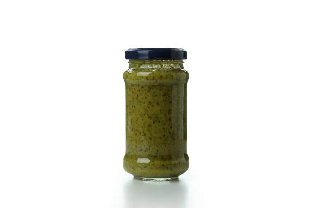 istock Jar of Pesto sauce isolated on white background 1436087236