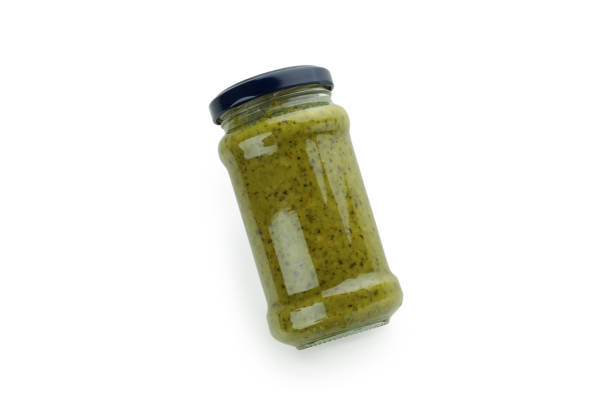 istock Jar of Pesto sauce isolated on white background 1436087266