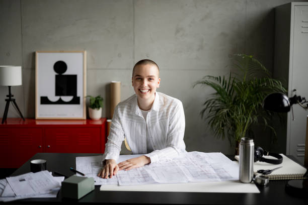 istock Smiling young bald woman looking at camera 1436087484