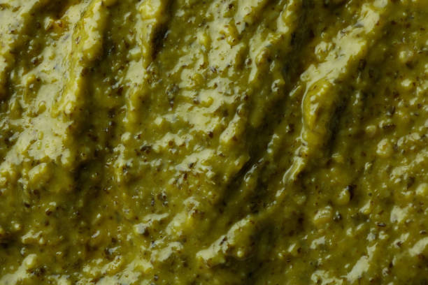 istock Tasty Pesto sauce on whole background, close up 1436088000
