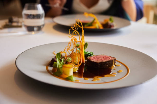 istock Guests sitting down to a main meal in a fine dining restaurant 1436089792