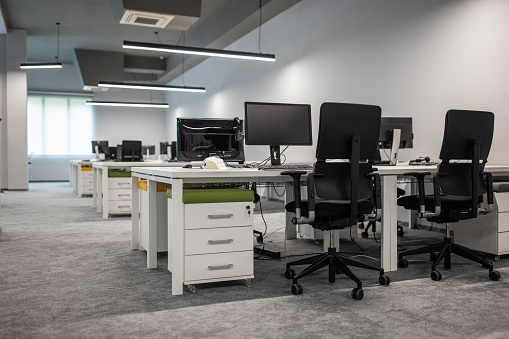 An empty office with computer equipment