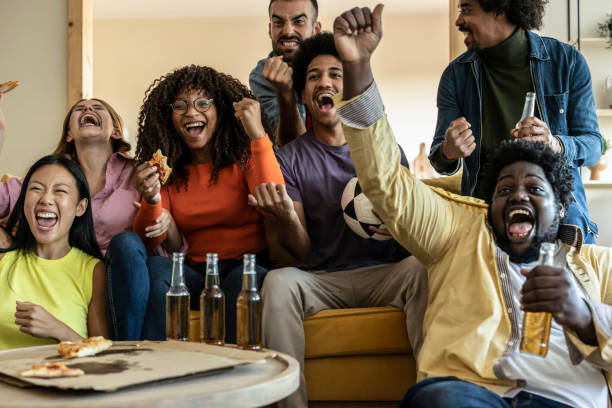 istock Multiracial fans celebrating goal 1436091630