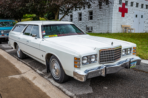 Des Moines, IA - July 01, 2022: High perspective front corner view of a 1976 Ford LTD Station Wagon at a local car show.