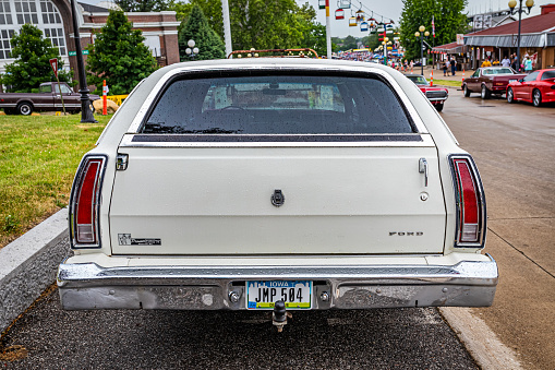 Des Moines, IA - July 01, 2022: High perspective rear view of a 1976 Ford LTD Station Wagon at a local car show.