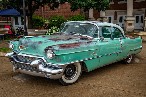 Des Moines, IA - July 01, 2022: High perspective front corner view of a 1956 Cadillac 62 Sedan DeVille at a local car show.