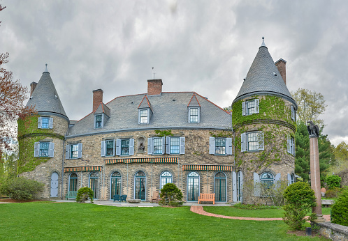 Milford, Pennsylvania, United States of America - May 2, 2017. French chateau-style home of the Grey Towers National Historic Site in Milford, PA. Also known as Gifford Pinchot House or The Pinchot Institute, is located just off US 6 west of Milford, Pennsylvania, in Dingman Township. It is the ancestral home of Gifford Pinchot, first director of the United States Forest Service (USFS) and twice elected governor of Pennsylvania. The house was designed by Richard Morris Hunt with some later work by H. Edwards Ficken. Situated on the hills above Milford, it overlooks the Delaware River.