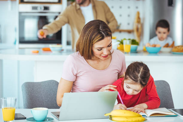 istock Young mother working from home with daughter. 1436096035
