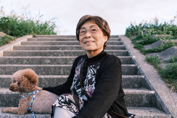 istock Senior woman with a dog. 1436096284