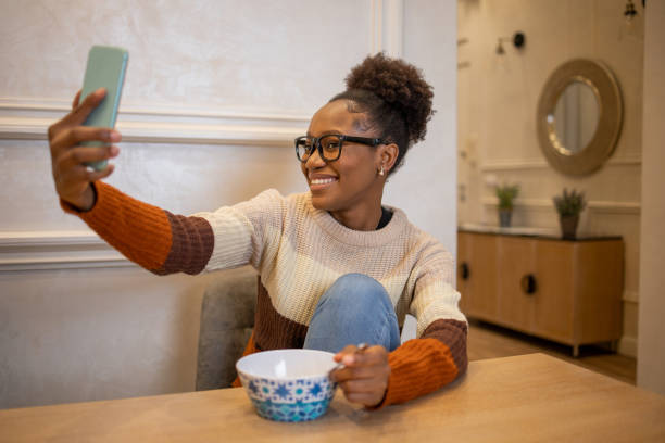 istock Portrait of a young woman using smartphone 1436098556