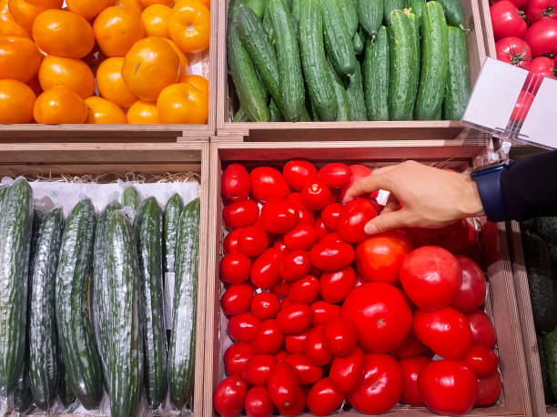 istock buying vegetables(cucumbers, tomatoes, onions, peppers, eggplant, zucchini) at the market 1436098751