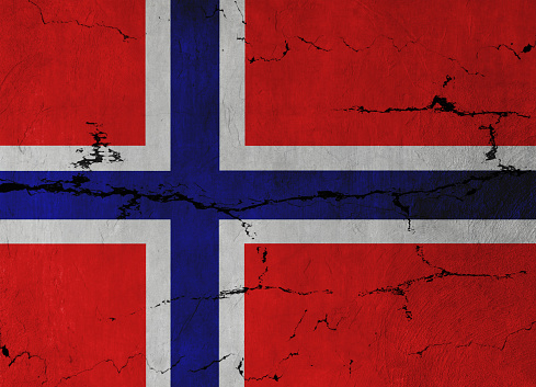 Norwegian Flag Flag on cracked wall background.