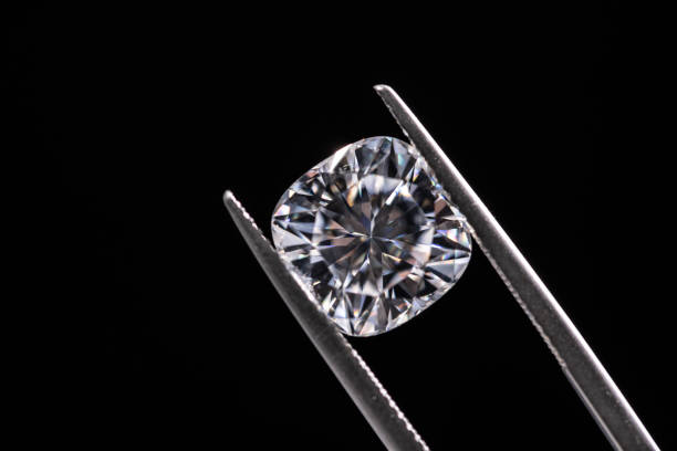 istock Diamond in Tweezers 1436101595