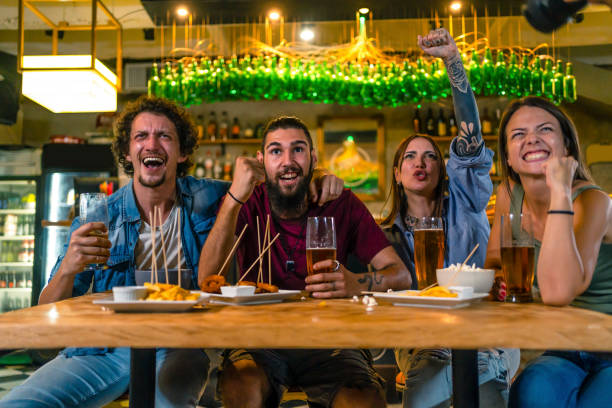 istock Friends in the pub watching a sports game 1436104908