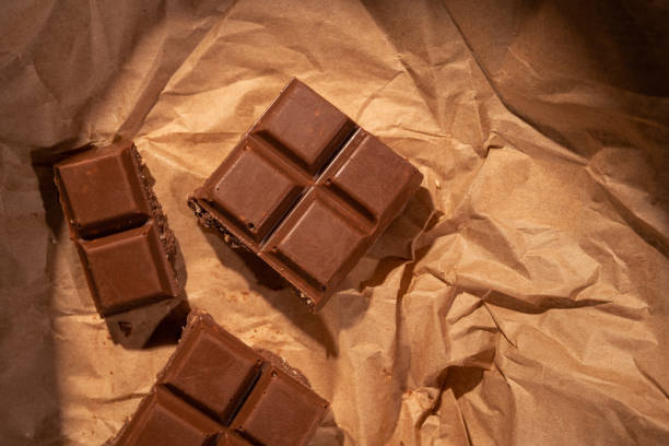 istock Chocolate bar pieces on kraft paper. 1436105086