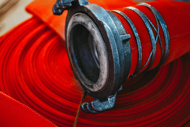 istock Red fire hose close-up. Abstract background or splash screen 1436107073