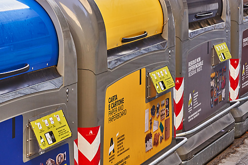 Collection of waste bins full of different types of garbage, recycling and separate waste collection concept