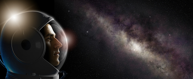 Head shot of astronaut wearing a helmet in outer space looks at the milky way. 3D rendering element. Concept of space travel and exploration.