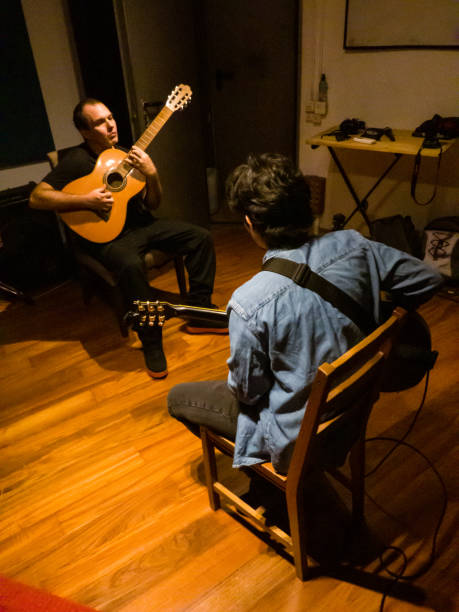 istock A guitar student receiving a class in a music studio 1436108571