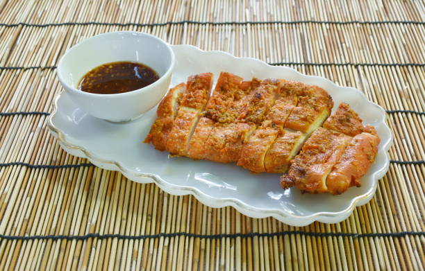 istock grilled slice chicken breast dipping with spicy sauce 1436108771
