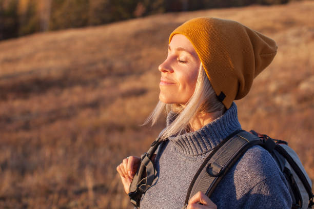 istock Middle Aged Woman Hiking and going Camping in nature 1436110325