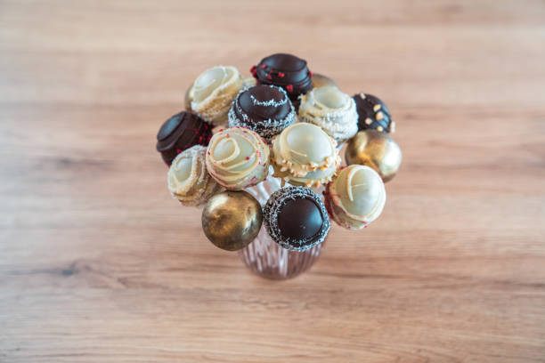 A blue bucket filled with chocolates and hearts, a sweet confectionery delight.