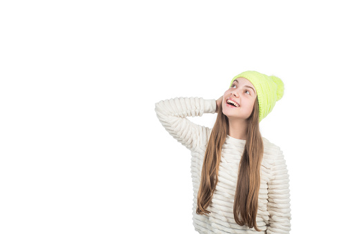 happy teen girl in knitted hat warm clothes isolated on white copy space, fashion.