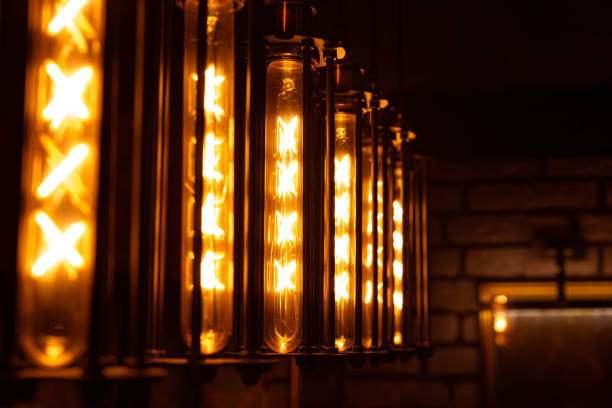 Light vintage bulbs lantern in loft style. Warm light. Beautiful retro interior. Dark room background.
