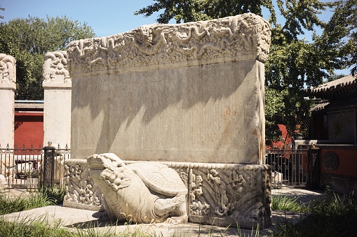 Old, worn out and illegible tombstone in St. Matthews cemetery in Quebec city during springtime day