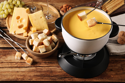 Delicious Swiss Cheese Fondue in a Pot Served with Bread