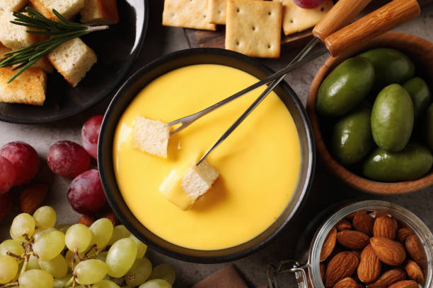 istock Tasty cheese fondue and snacks on grey table, flat lay 1436119238