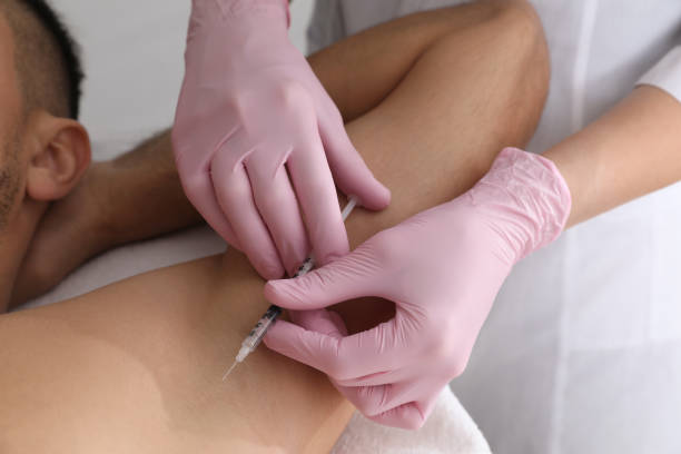 istock Cosmetologist injecting man's armpit, closeup. Treatment of hyperhidrosis 1436120482