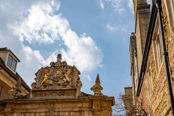 Oxford, United Kingdom - Dec 22, 2025: A close-up of a classical stone entrance with an ornate black wrought-iron gate and fanlight at the Radcliffe Camera, part of the Bodleian Library at the University of Oxford, England.