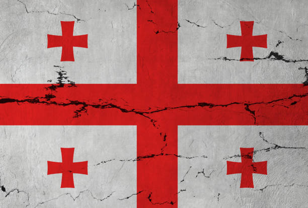 Georgia Flag on cracked wall background.
