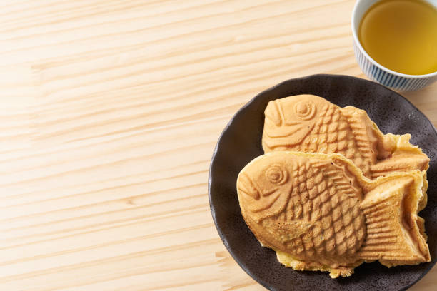 istock Japanese taiyaki, fish-shaped cake with sweet red bean paste 1436122911