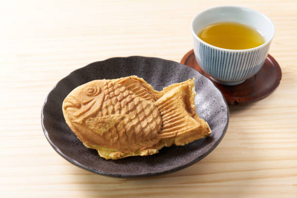 istock Japanese taiyaki, fish-shaped cake with sweet red bean paste 1436122925