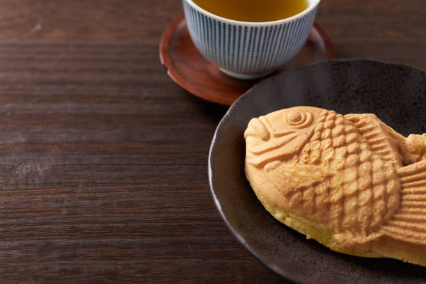 istock Japanese taiyaki, fish-shaped cake with sweet red bean paste 1436122948