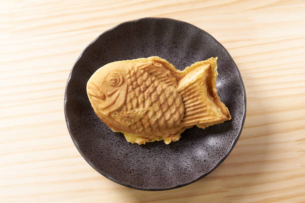istock Japanese taiyaki, fish-shaped cake with sweet red bean paste 1436122992