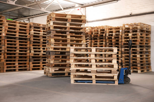 istock Modern manual forklift and wooden pallets in warehouse 1436122995