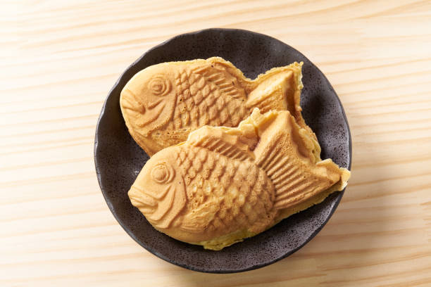 istock Japanese taiyaki, fish-shaped cake with sweet red bean paste 1436123011