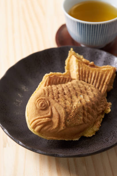 istock Japanese taiyaki, fish-shaped cake with sweet red bean paste 1436123043