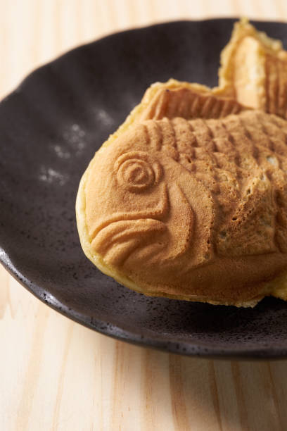 istock Japanese taiyaki, fish-shaped cake with sweet red bean paste 1436123061
