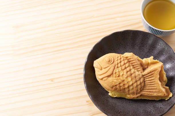 istock Japanese taiyaki, fish-shaped cake with sweet red bean paste 1436123074