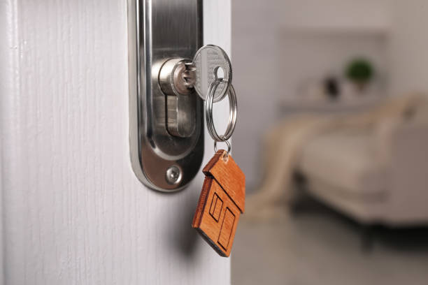 istock Closeup view of door with key open into room. Space for text 1436123441